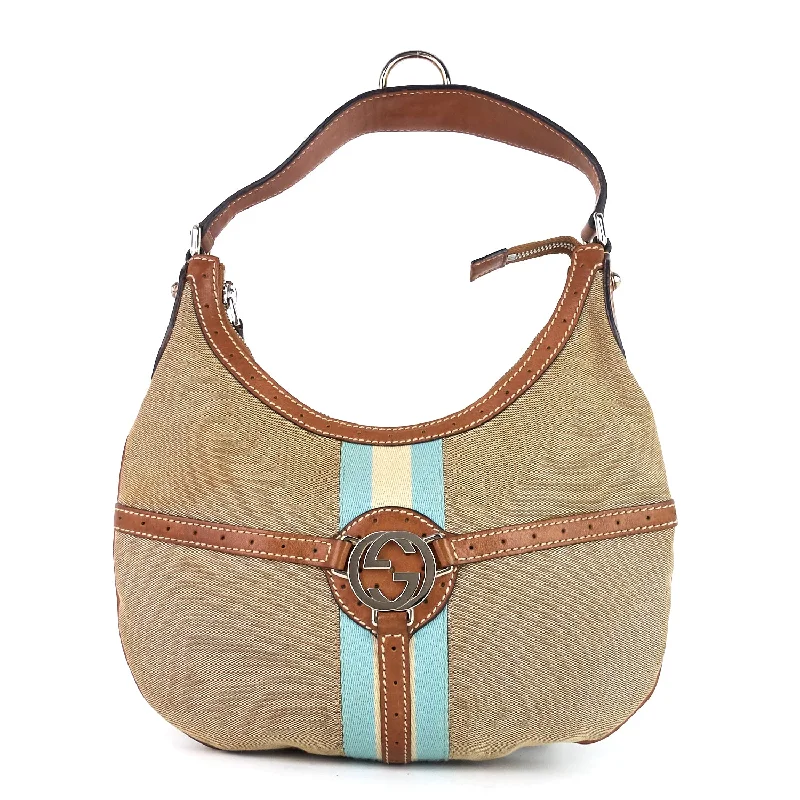 Women Gucci Sylvie bags featuring the signature web stripeWeb Reins Canvas Hobo Bag