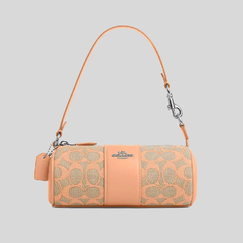 Coach Borough bags with a contrast - stitched handle for a unique lookCOACH Nolita Barrel Bag In Signature Jacquard Faded Blush CU003