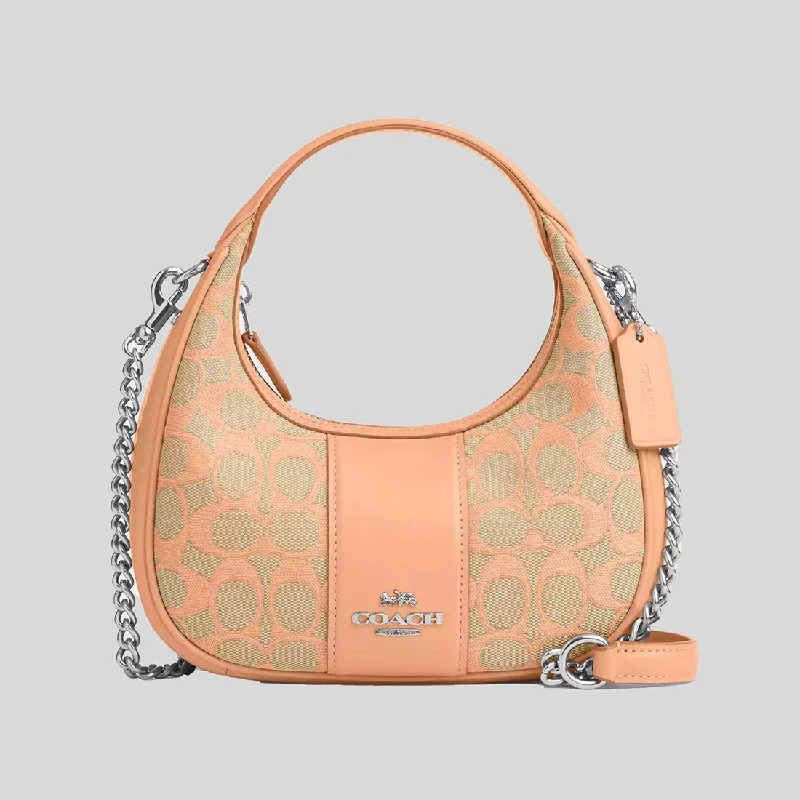 Coach handbags with a beaded trim for a glamorous and elegant lookCOACH Carmen Mini Crossbody In Signature Jacquard Faded Blush CT773