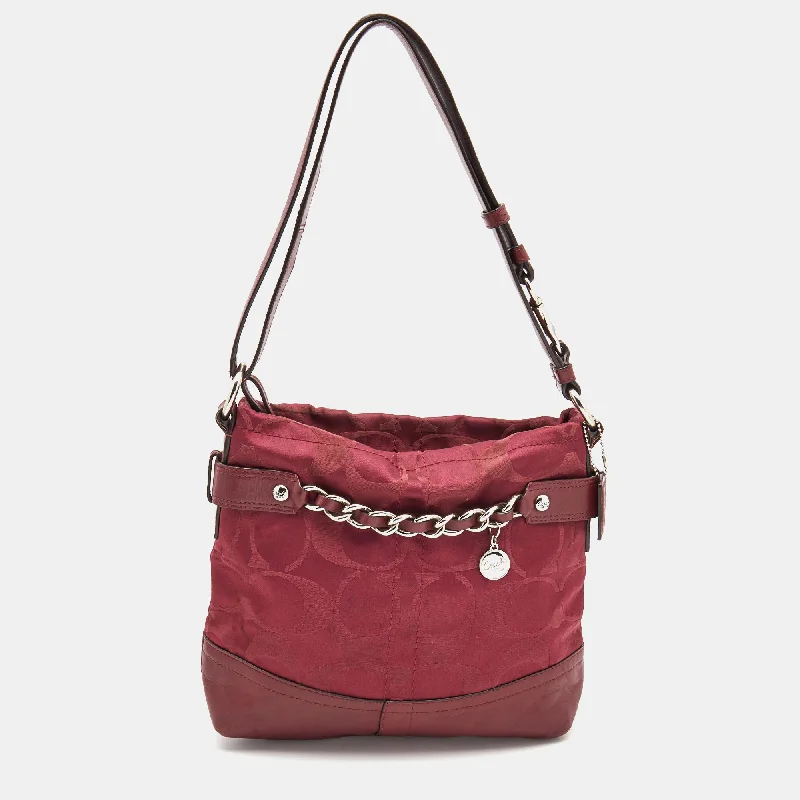 Coach Rogue bags featuring the signature C - hardware for a branded lookBurgundy Signature Satin and Leather Chain Detail Hobo