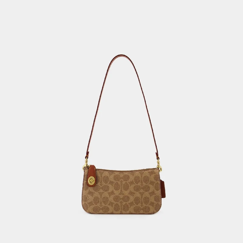 Ladies Coach Borough bags in a pastel shade for a soft and delicate appearanceSignature Penn Shoulder Bag - Coach - Canvas - Tan Rust