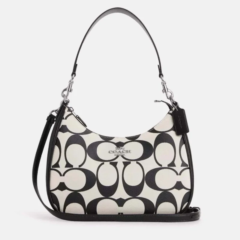 Coach Dempsey bags with a large capacity and a drawstring closureBlack/White leather Teri Hobo In Signature Canvas