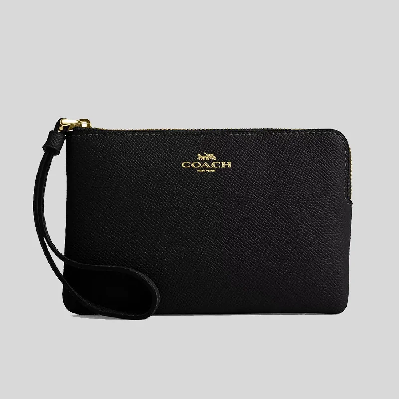 Coach handbags with a perforated leather detail for a breathable and unique designCOACH Corner Zip Wristlet Black CV396