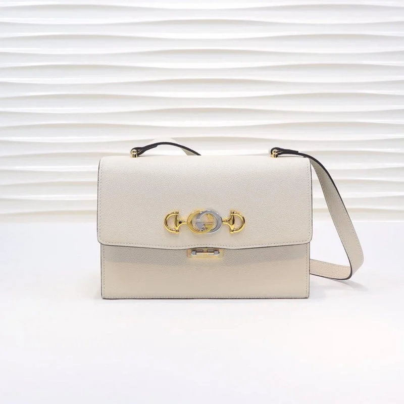 Women Gucci bags with a snap - button closure and a decorative charmBC - GUCCI BAG - 1139