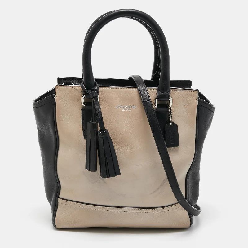 Coach bags with a zippered interior pocket for separating itemsBlack/Beige Leather Tassel Tote