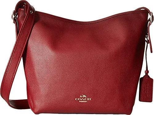 Coach Rogue bags with a monogram - embossed leather surfaceCOACH Women's Polished Pebble Leather Dufflette LI/Black Cherry Shoulder Bag