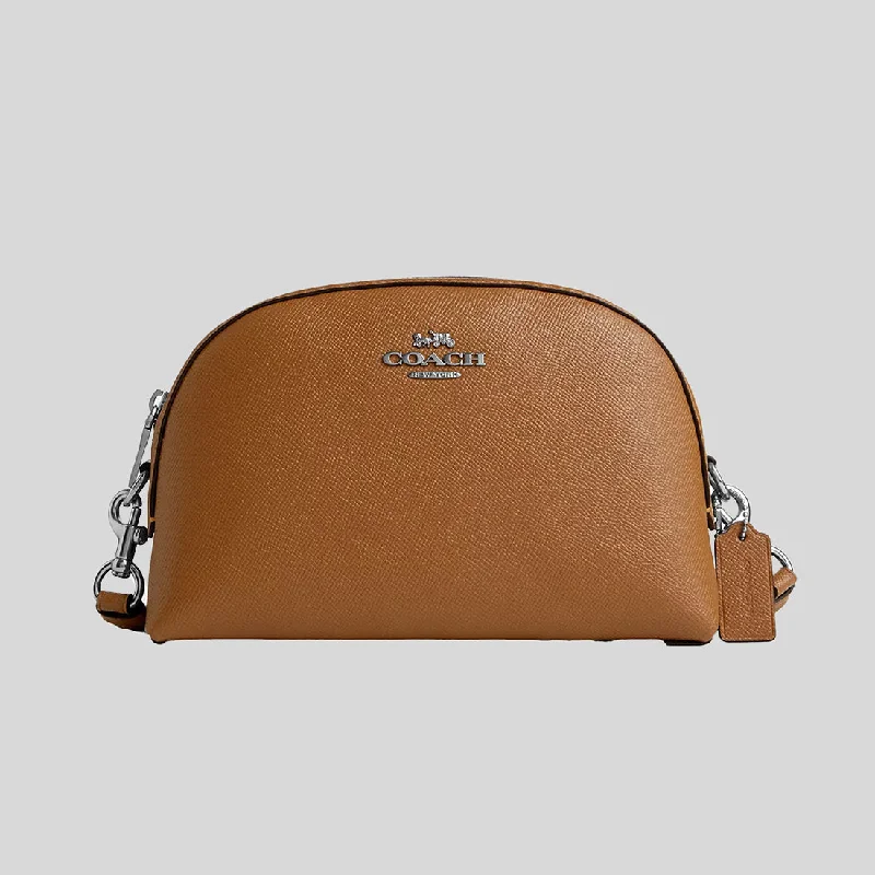 Coach Rogue bags featuring the signature C - hardware for a branded lookCOACH Madi Crossbody Bag Light Saddle CR348