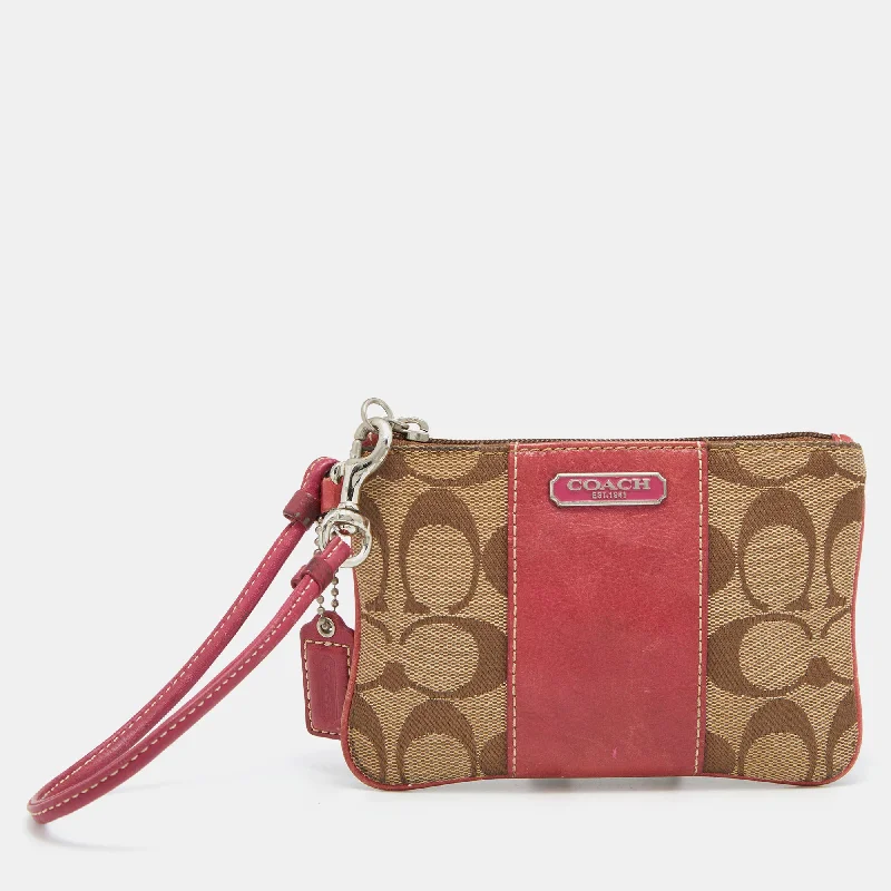 Ladies Coach Tabby bags with a textured leather surface for a more tactile lookBeige/Pink Signature Canvas and Leather Wristlet Pouch