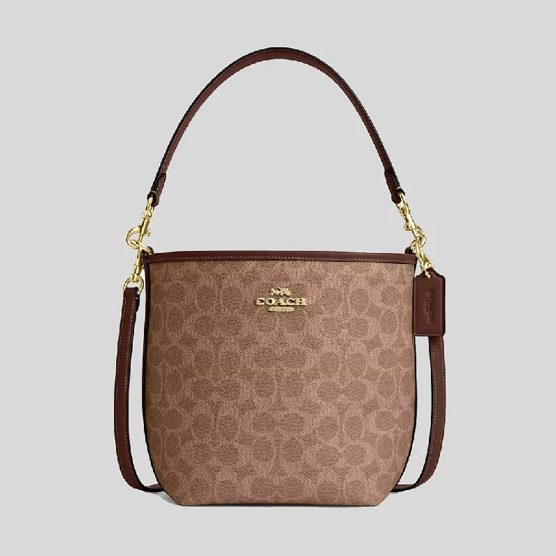 Coach tote bags with a snap - button closure and a decorative charm for styleCOACH City Bucket Bag In Signature Canvas Tan/Brown CT800