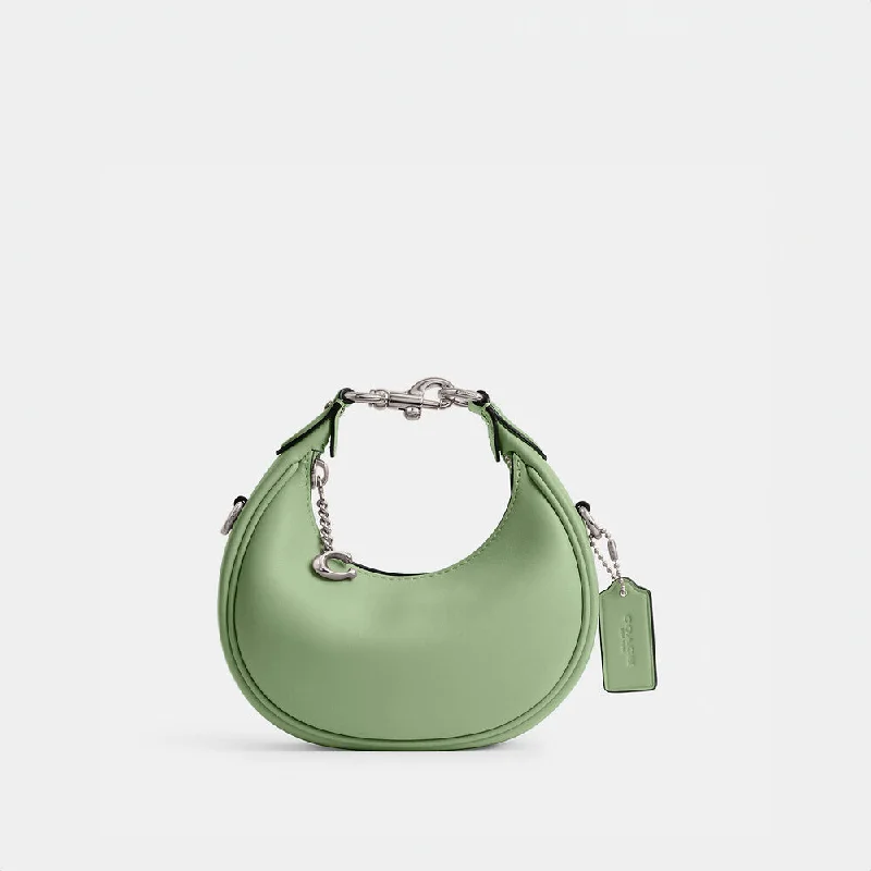 Coach crossbody bags with a woven leather strap for a unique textureCoach Jonnie Bag Pale Pistachio