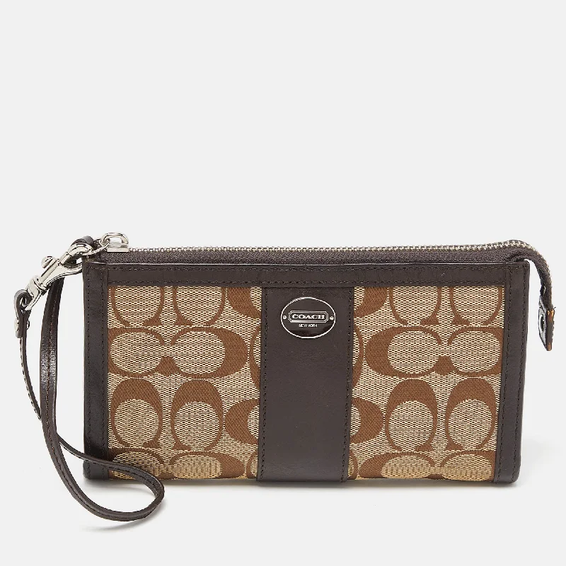 Coach Dempsey bags with a large capacity and a drawstring closureBrown/Beige Signature Canvas and Leather Zip Wristlet Pouch