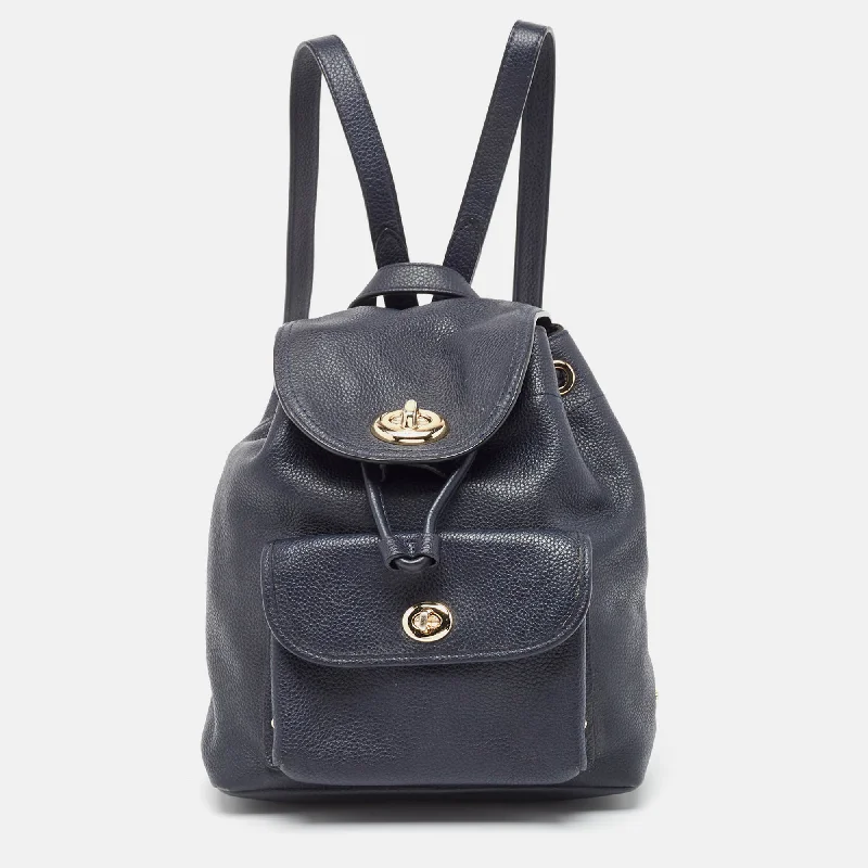 Coach handbags with a perforated leather detail for a breathable and unique designBlack Leather Mini Turnlock Rucksack Backpack