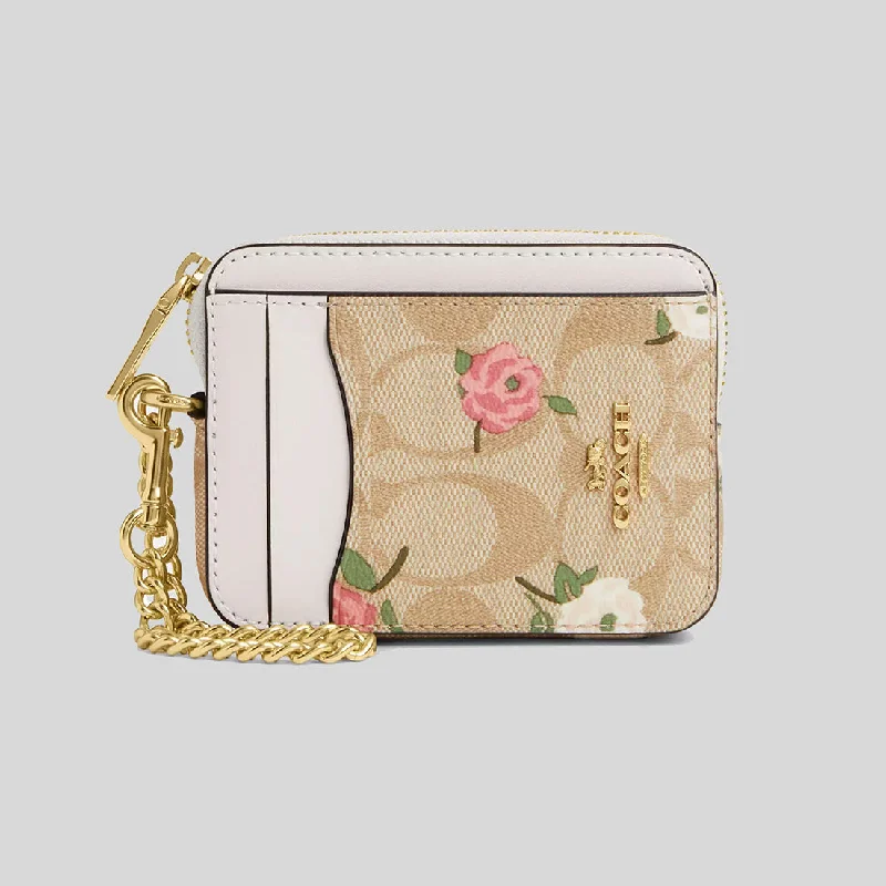 Coach Rogue bags featuring the signature C - hardware for a branded lookCOACH Zip Card Case In Signature Canvas With Floral Print CR971