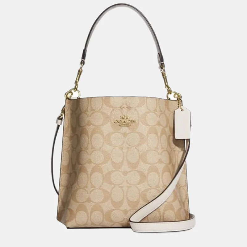 Coach bags with a zippered interior pocket for separating itemsBeige Canvas Bucket Bag