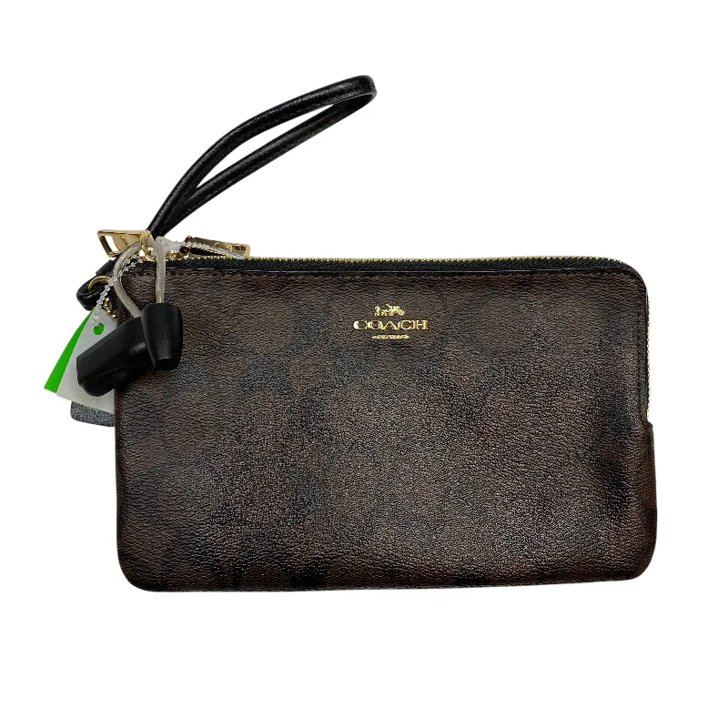 Coach handbags with a perforated leather detail for a breathable and unique designWristlet Designer By Coach, Size: Large