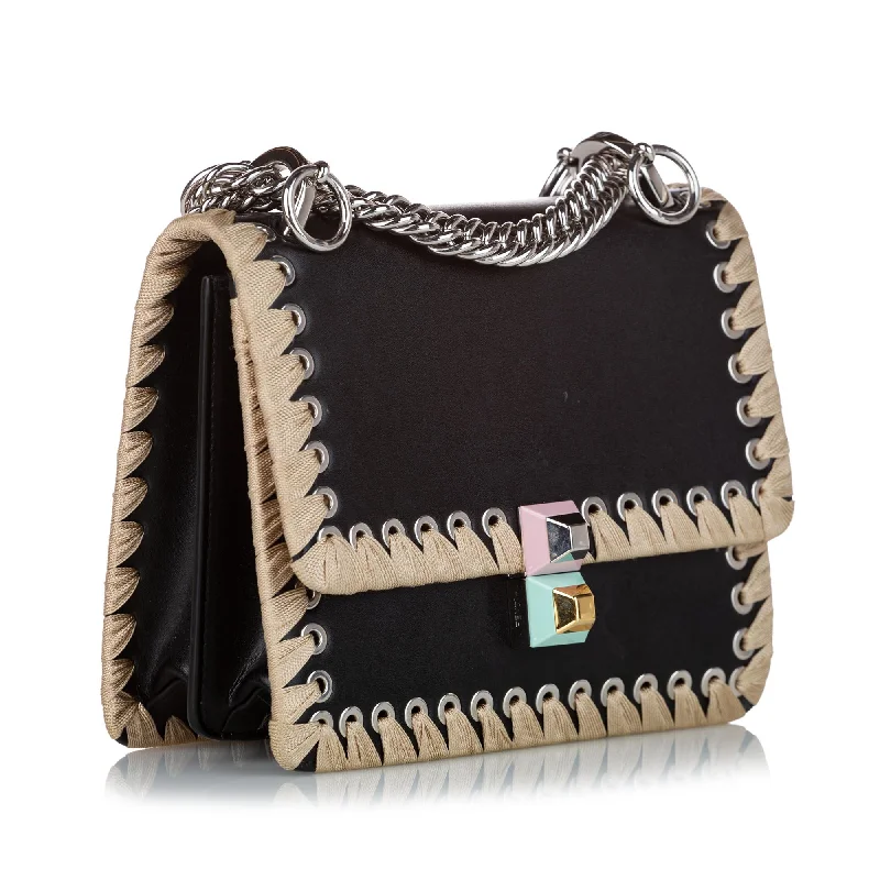 Fendi Baguette bags with a studded leather trim for a bold and edgy lookFendi Kan I Lace Up Leather Crossbody Bag (SHG-27940)