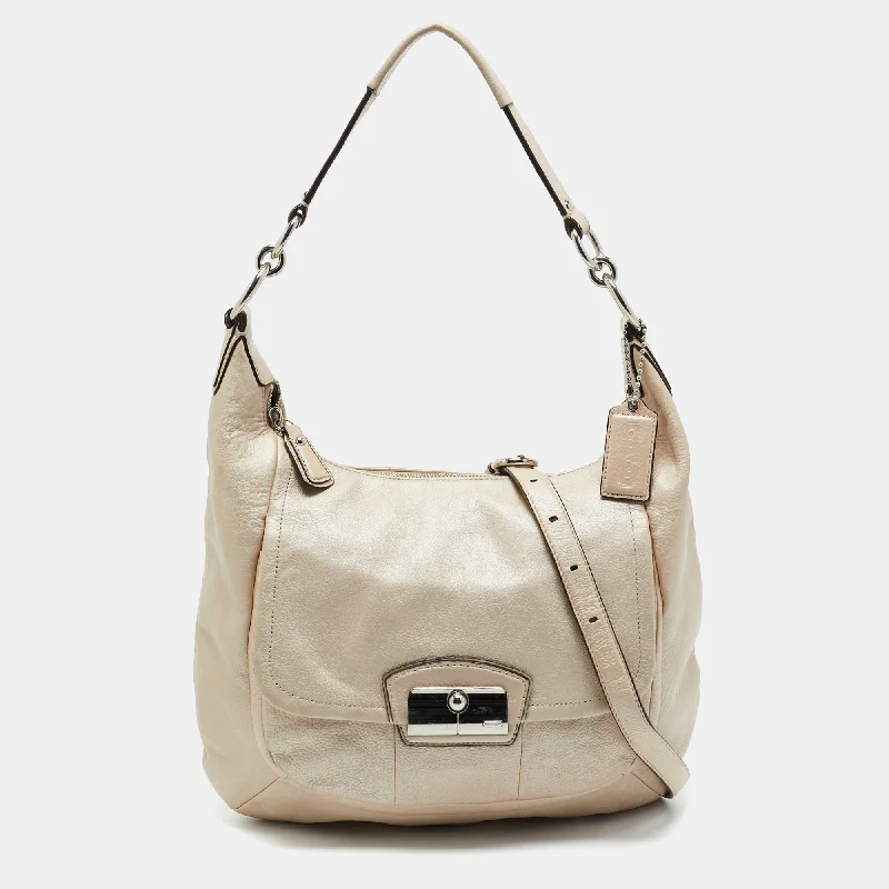 Coach Dempsey bags with a crystal - embellished C - logo for added luxuryIvory Leather Kristin Hobo