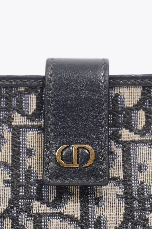 Christian Dior handbags with a snap - button closure and a decorative buckleChristian Dior 5 Card Holder Blue And Grey Oblique Leather